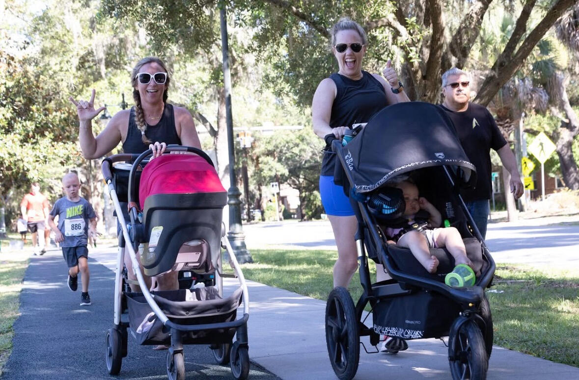 Families with strollers crossing the finish